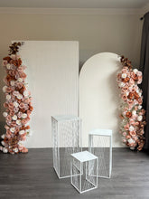 Load image into Gallery viewer, Package Hire includes 2 MDF Wooden backdrops + 3 plinths + 2 faux flowers +draping