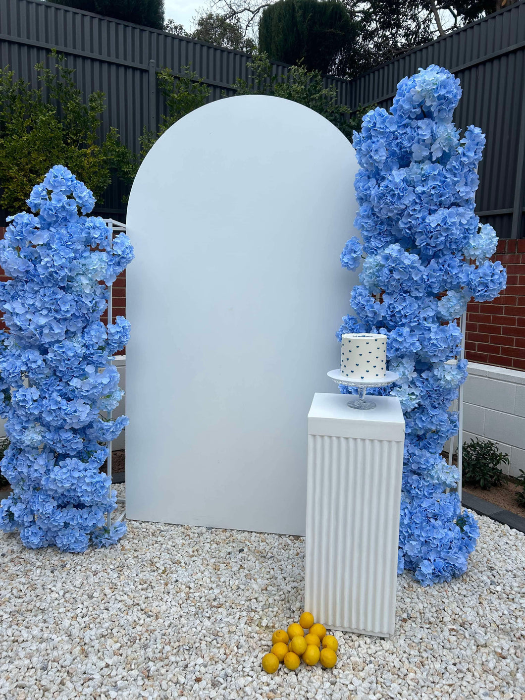 Package Hire includes 1 MDF Wooden backdrop + 1 plinth + 2 flowers