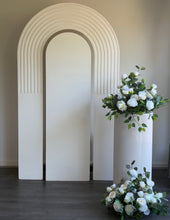 Load image into Gallery viewer, Package Hire includes 1 wooden backdrop 2.15cm h x 1.2m w + 1 ripple plinth + 3 flowers
