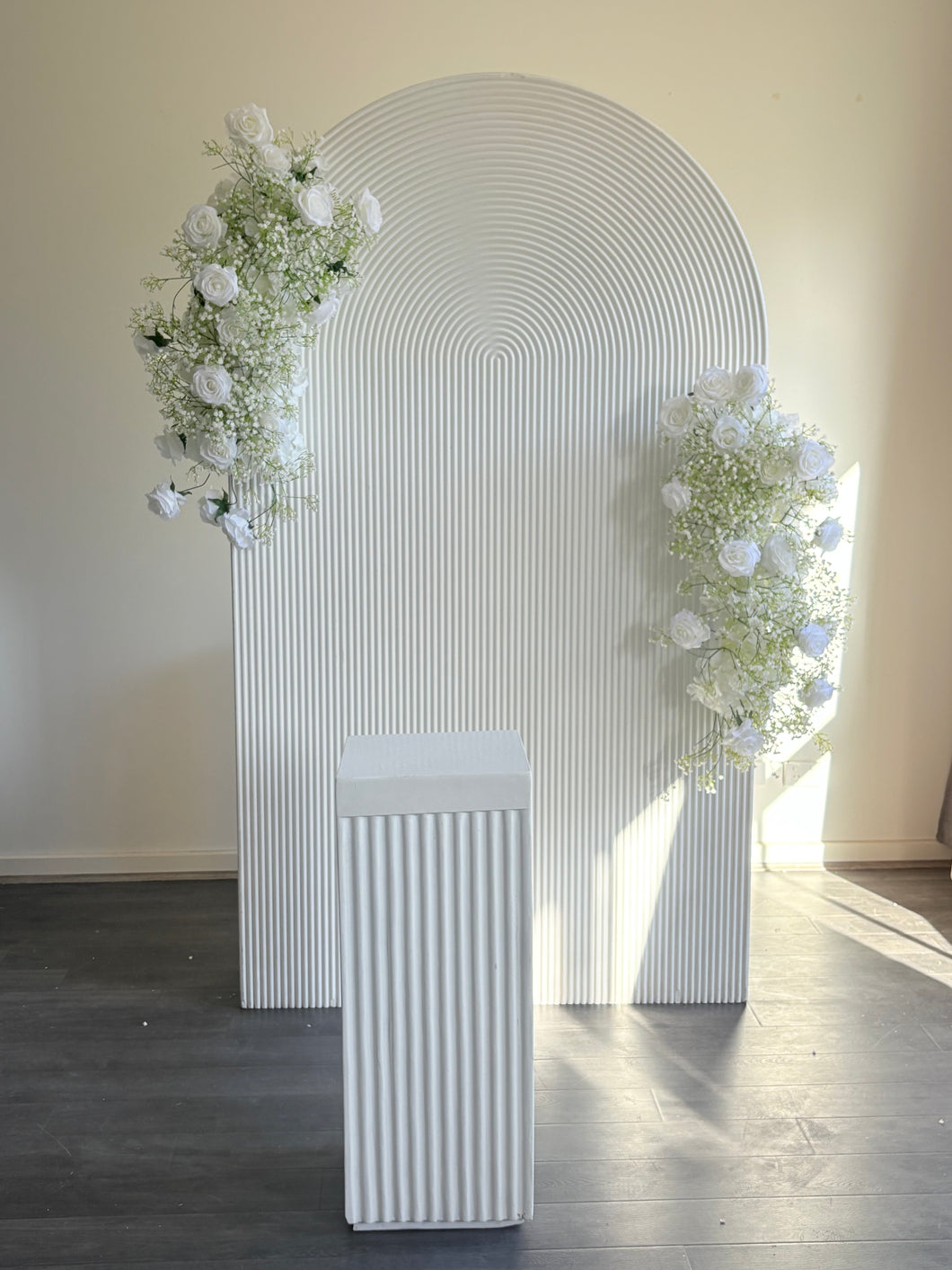 Package Hire includes 1 ripple backdrop 2.15m H x 1.2m W +1 plinth + 2 flowers