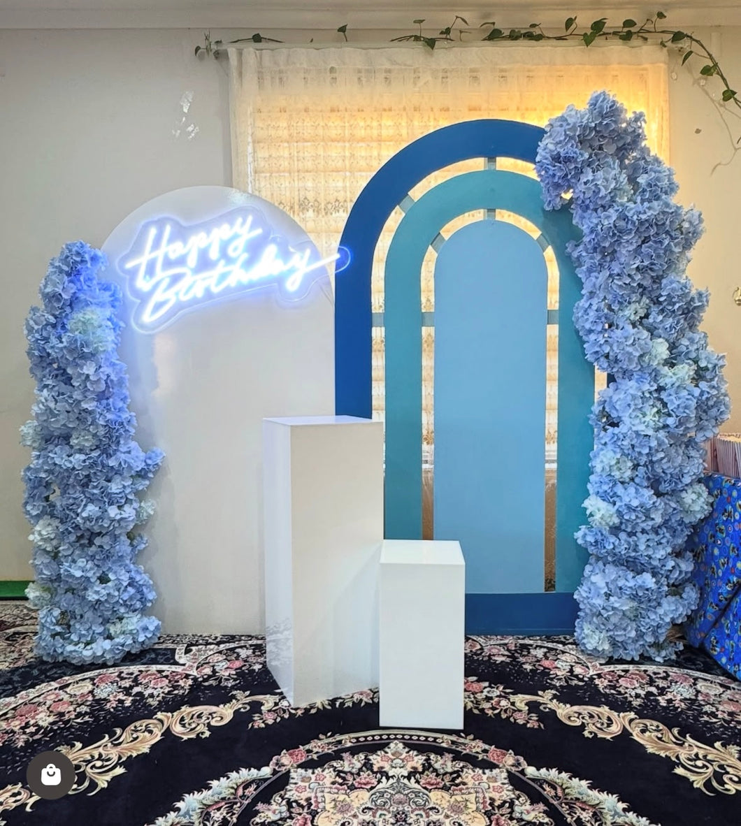 Package Hire includes 2 MDF Wooden backdrops + 2 plinths + 2 flowers + neon sign