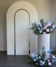 Load image into Gallery viewer, Package Hire includes 1 wooden backdrop 2.15cm h x 1.2m w + 1 ripple plinth + 2 flowers
