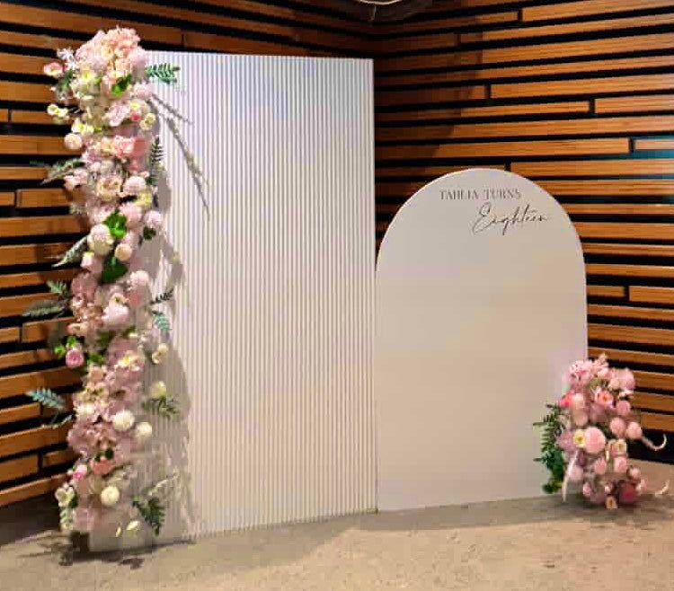 Package Hire includes 2 MDF Wooden backdrops 2m -1.6m H x 1- 1.2m W each + flowers