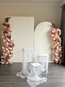 Package Hire includes 2 MDF Wooden backdrops + 3 plinths + 2 faux flowers +draping