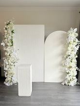 Load image into Gallery viewer, Package Hire includes 2 MDF Wooden backdrops + plinth + 2 faux flowers
