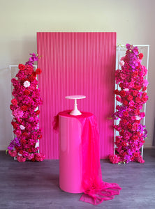 Package Hire includes 1 wooden ripple backdrop 2mH x 1.2m W +1 plinth + 2 flowers