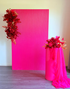 Package Hire includes 1 wooden ripple backdrop 2mH x 1.2m W +1 plinth + 3 flowers