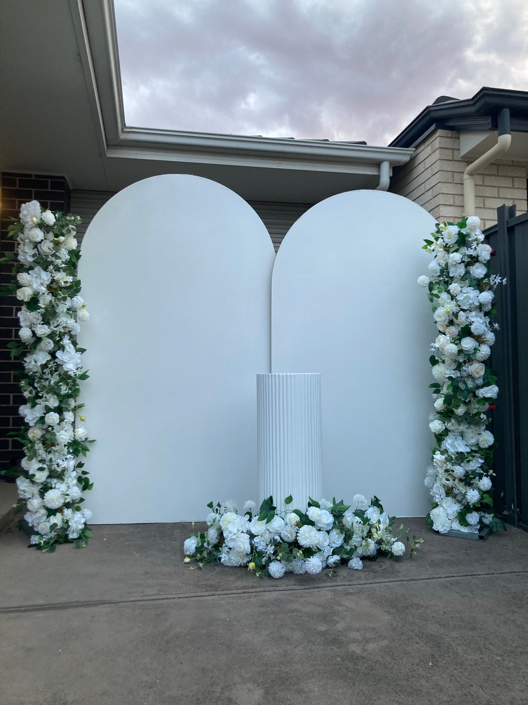 Package Hire includes 2 MDF wooden backdrops + 1 ripple plinth + flowers