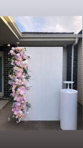Package hire includes flowers + 1 plinth + 1 ripple backdrop
